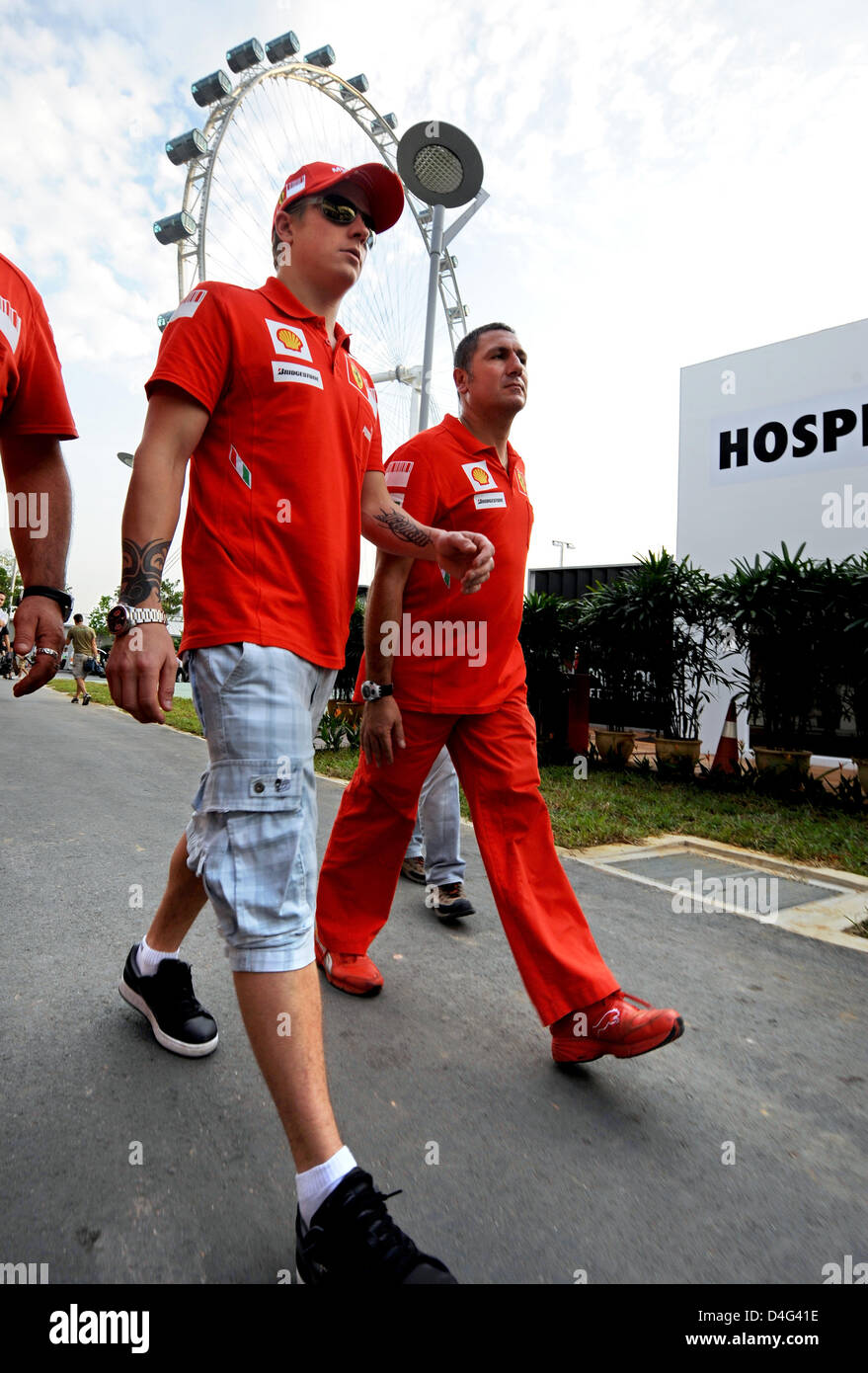Finnish Formula One driver Kimi Raikkonen (L) of Scuderia Ferrari