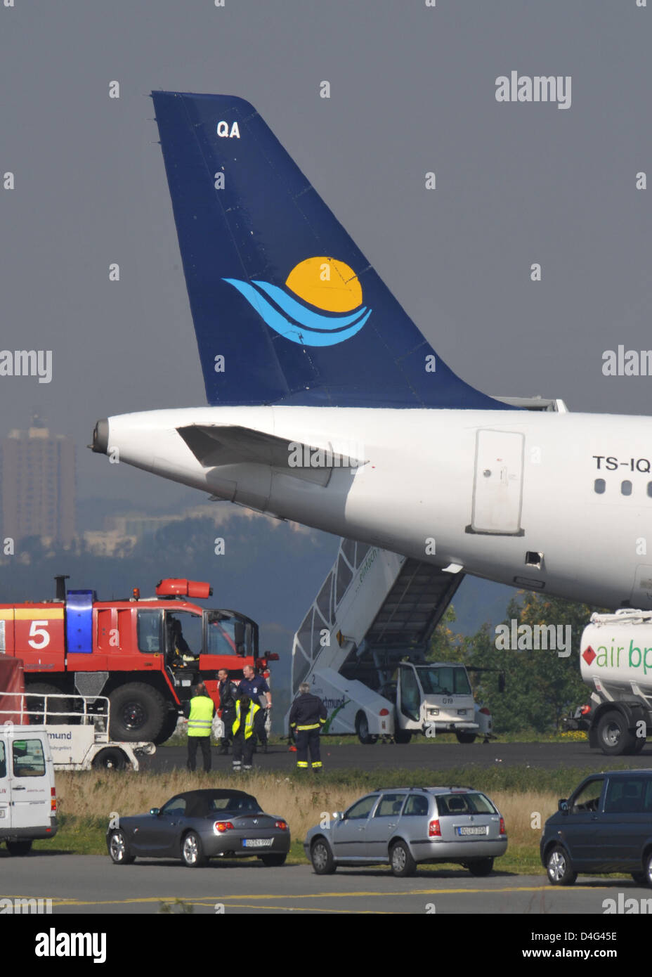 An Airbus A321 of Tunesian carrier Nouvel Air pictured at the end of the landing strip of Dortmund airport, Germany, 26 September 2008. The plane boarded by 168 passengers has rolled beyond the airstrip, its nose wheel got stuck in the ground. Experts examined the aircraft that is to recovered later the day. Dortmunairport's landing airstrip is with a length of 2,000 metres more th Stock Photo