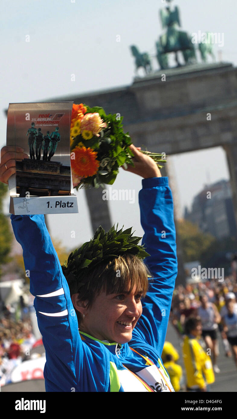 German marathon runner Irina Mikitenko is happy about her victory at Berlin Marathon in Berlin, Germany, 28 September 2008. Mikitenko accomplished the first home victory since 13 years at Berlin Marathon and also achieved the fastest time ever run by a German woman. She won in 2:19.19 hours. Photo: Klaus-Dietmar Gabbert Stock Photo