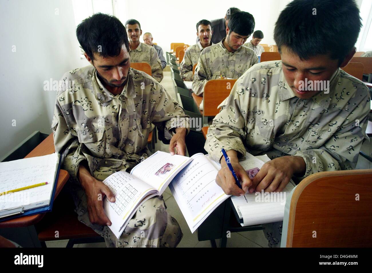 Police Project Team Afghan border police officers learn how to read and write in Mazar-i ...
