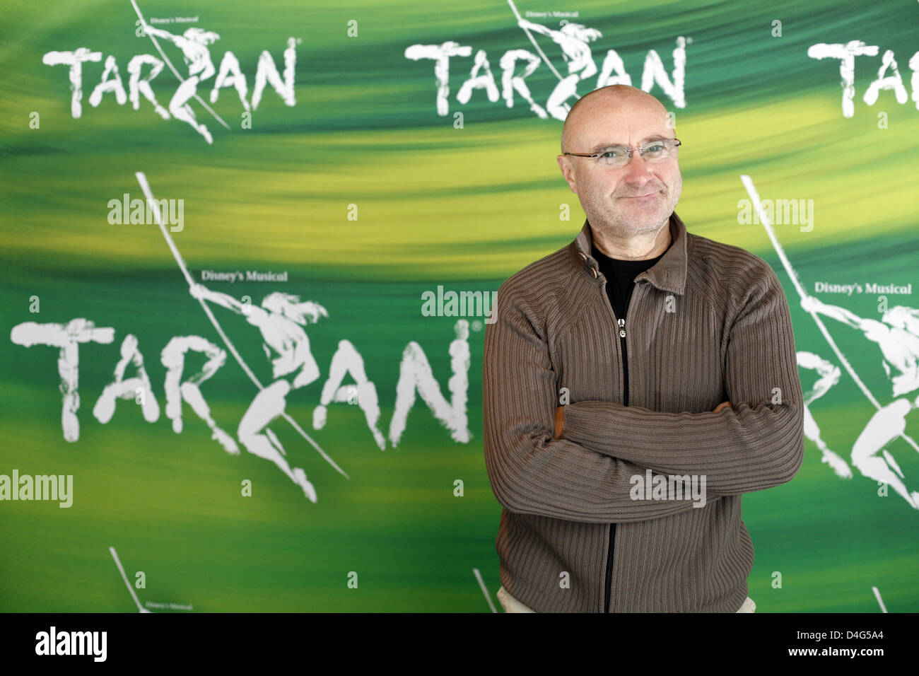 English musician Phil Collins poses with the poster of the new Disney musical 'Tarzan' in Hamburg, Germany, 02 October 2008. The show with music by Collins premieres in Hamburg on 19 October 2008. Photo: SEBASTIAN WIDMANN Stock Photo