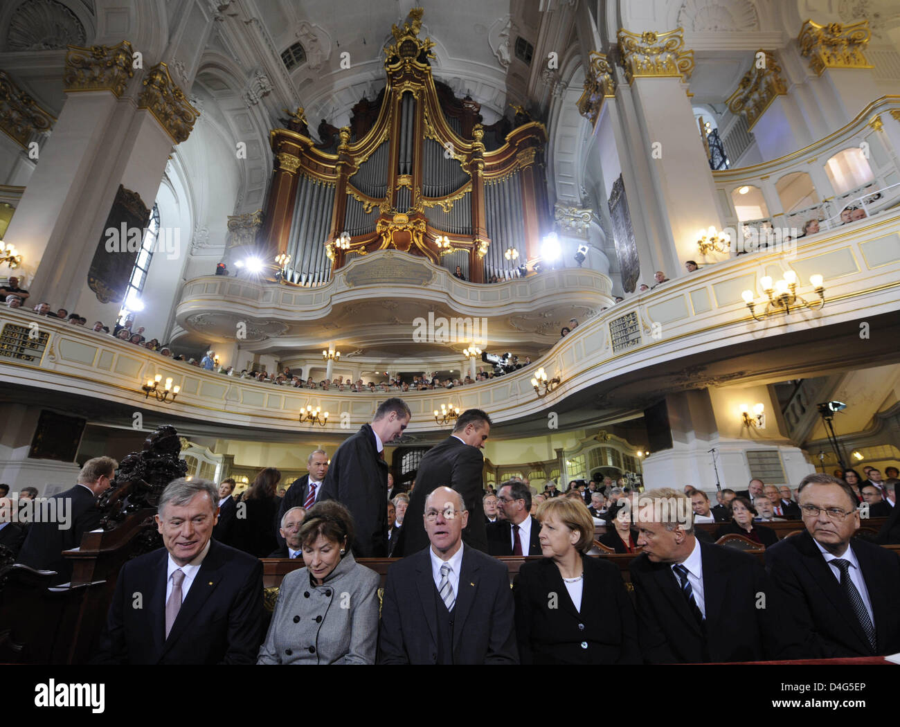 German President Horst Koehler (L-R), his wife Eva Luise, President of the German Parliament Norbert Lammert, German Chancellor Angela Merkel, Mayor of Hamburg Ole von Beust and President of the Constitutional Court Hans-Juergen Papier attend the ecumenical service on 'German Unity Day' at St. Michaelis Church, Hamburg, Germany, 03 October 2008. Over 1,500 guests gathered at Hambur Stock Photo