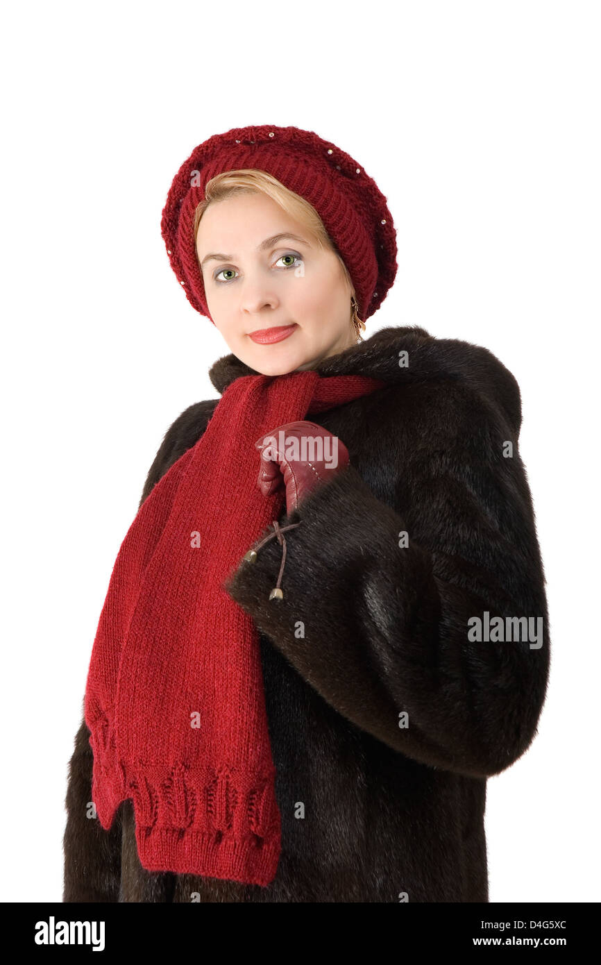 The beautiful woman in a fur-coat on the white background Stock Photo