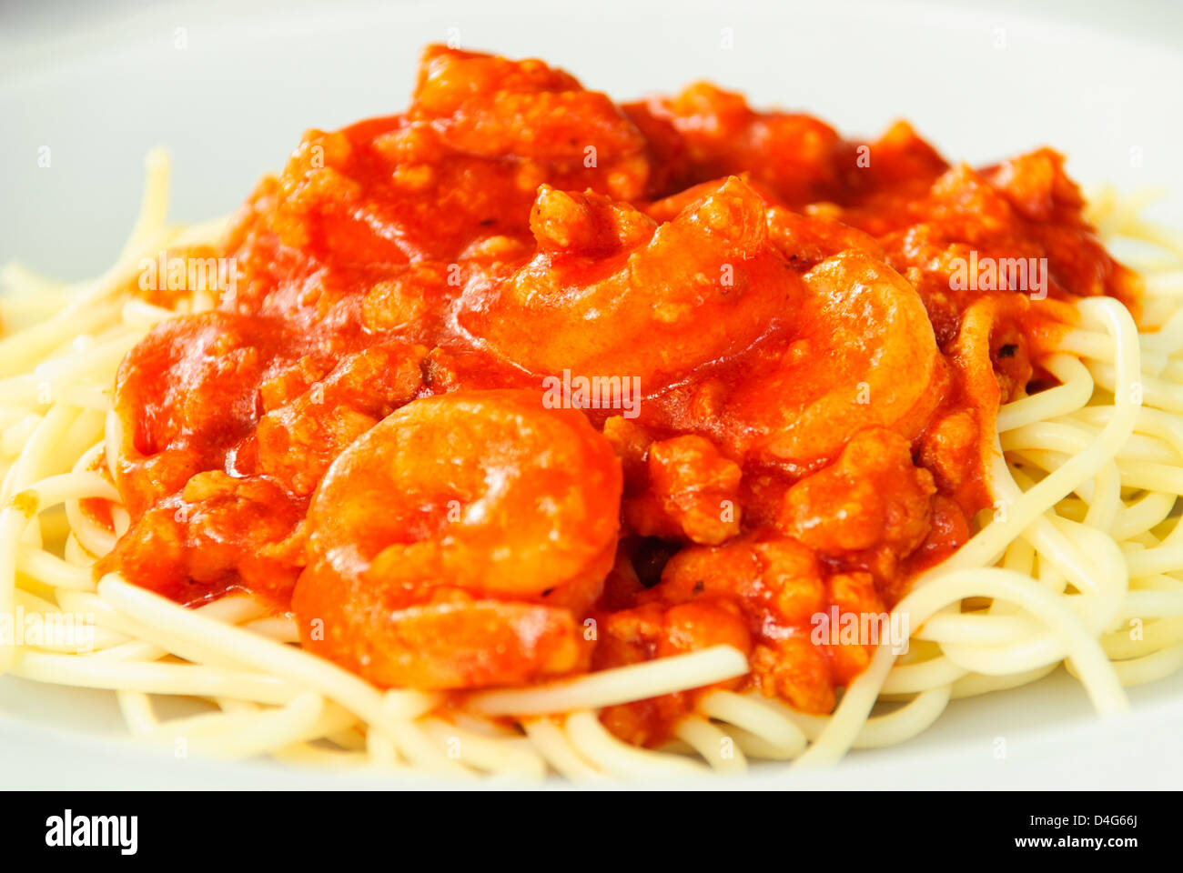 spaghetti chicken and the shrimp pour tomato sauce Stock Photo