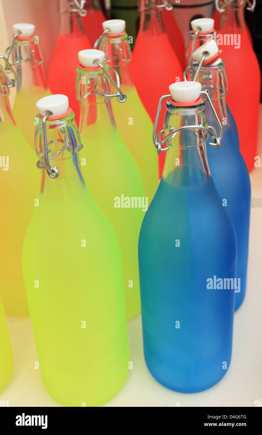 Brightly coloured glass bottles Stock Photo
