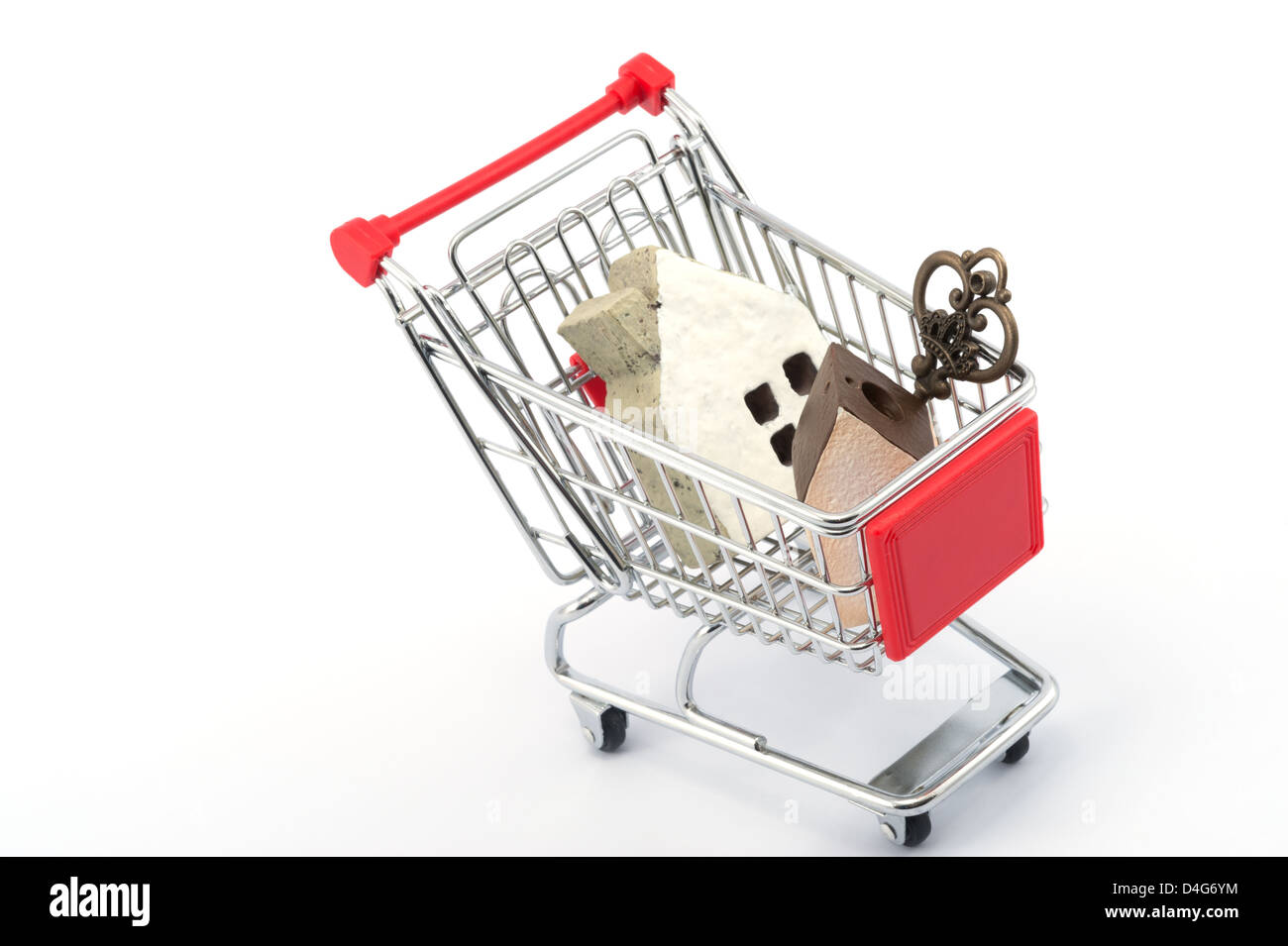 Key and house models in shopping cart on white background Stock Photo