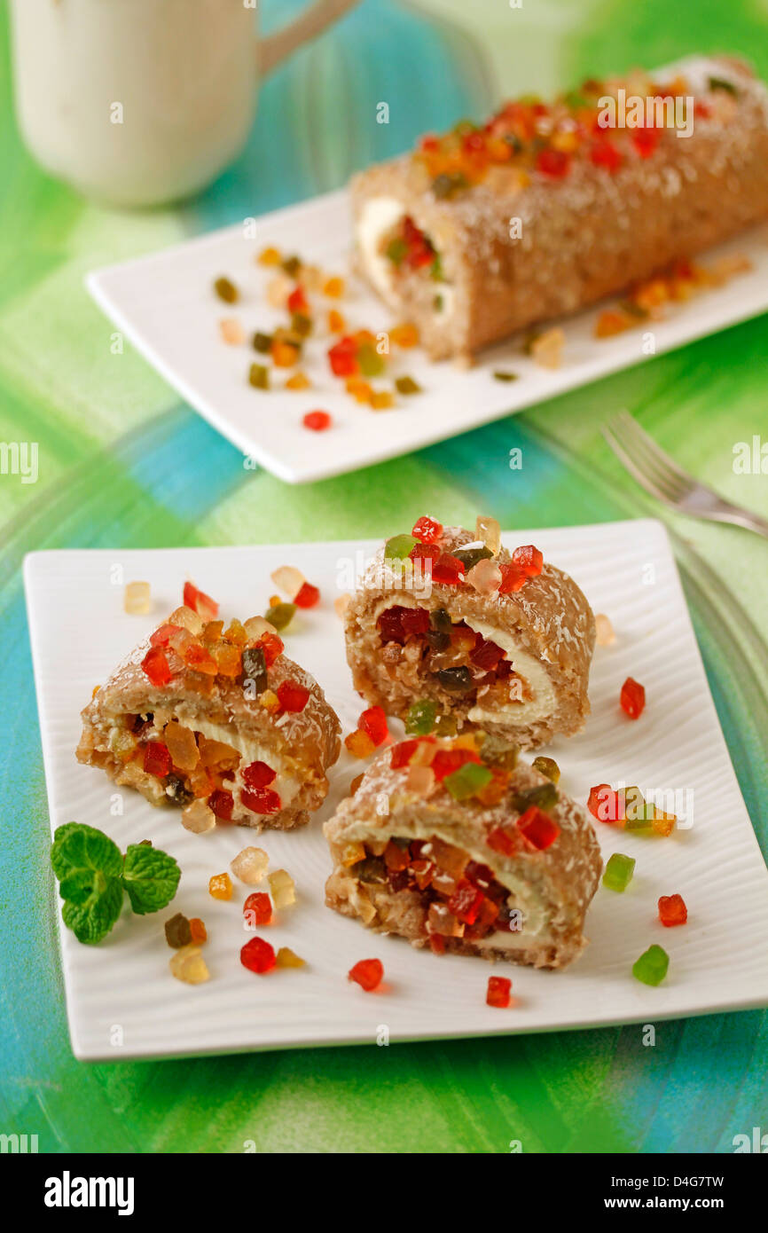 Banana roll with cheese and candied fruits. Recipe available. Stock Photo