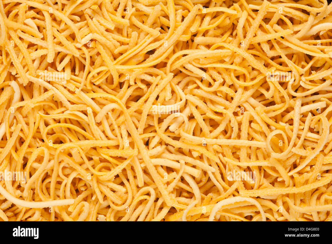 dried pasta background or yellow noodles texture Stock Photo