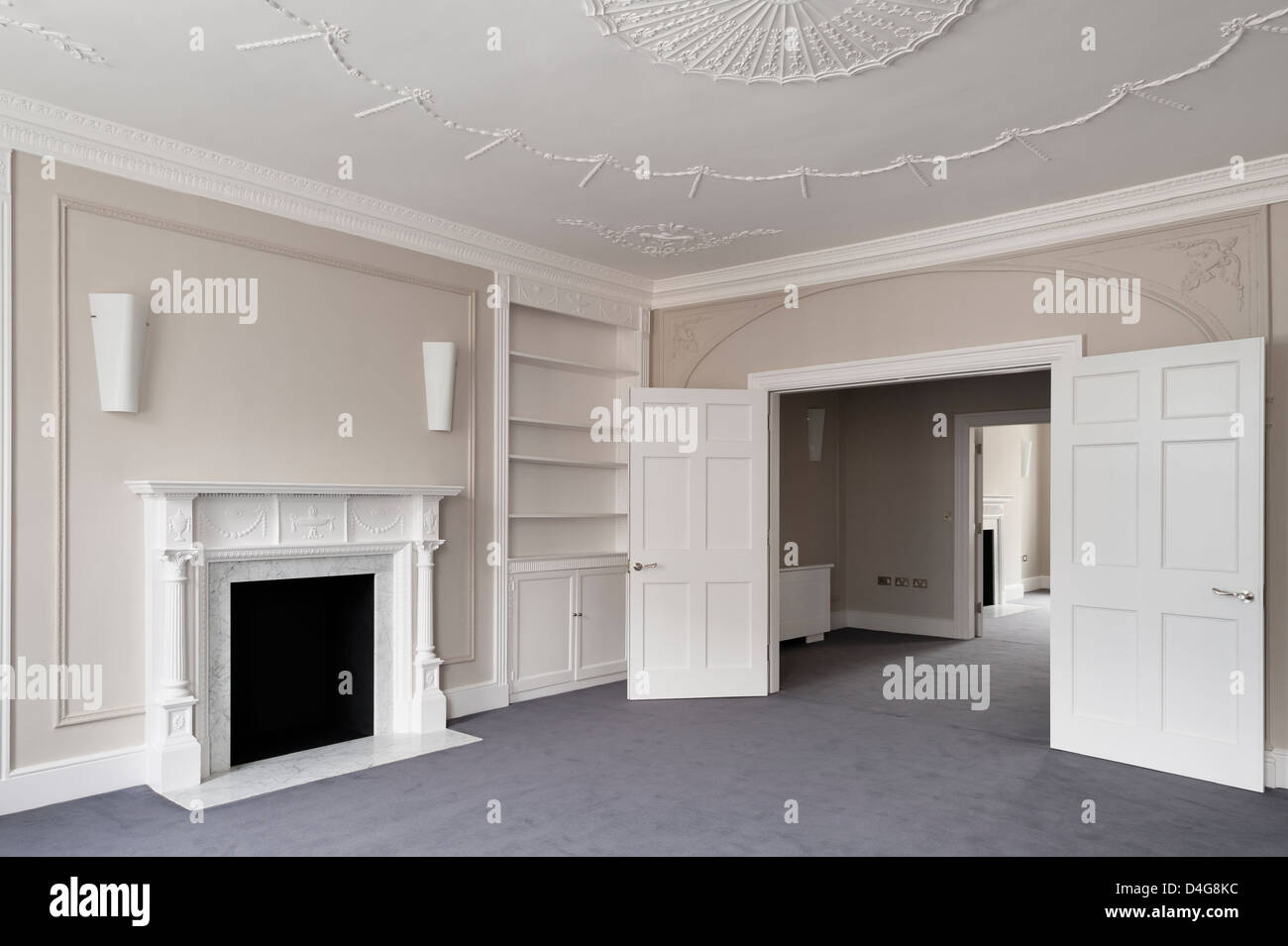 empty communicating rooms with open doors and fireplace Stock Photo