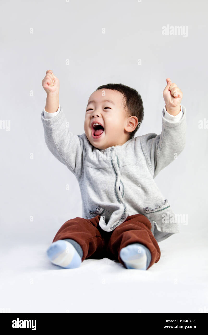 Cute little boy shouting with excitement Stock Photo