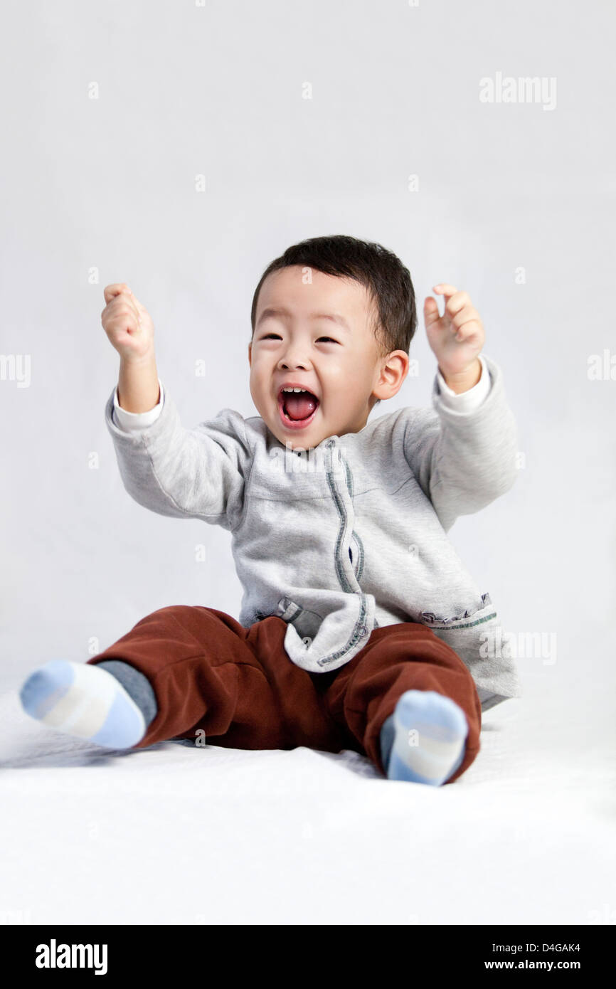 Cute little boy shouting with excitement Stock Photo