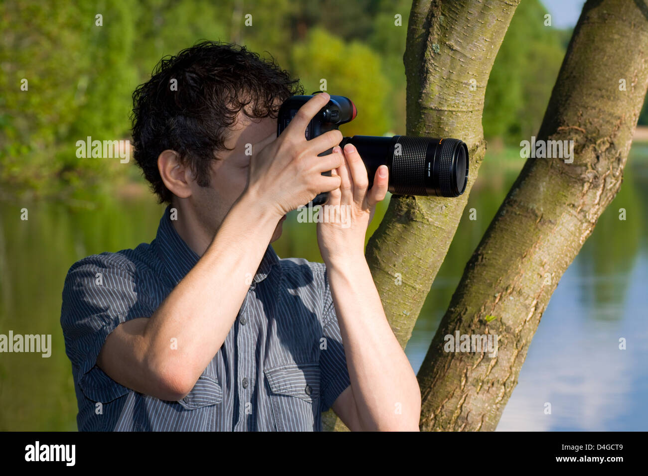 Sneaky photographer getting his shot of nature Stock Photo