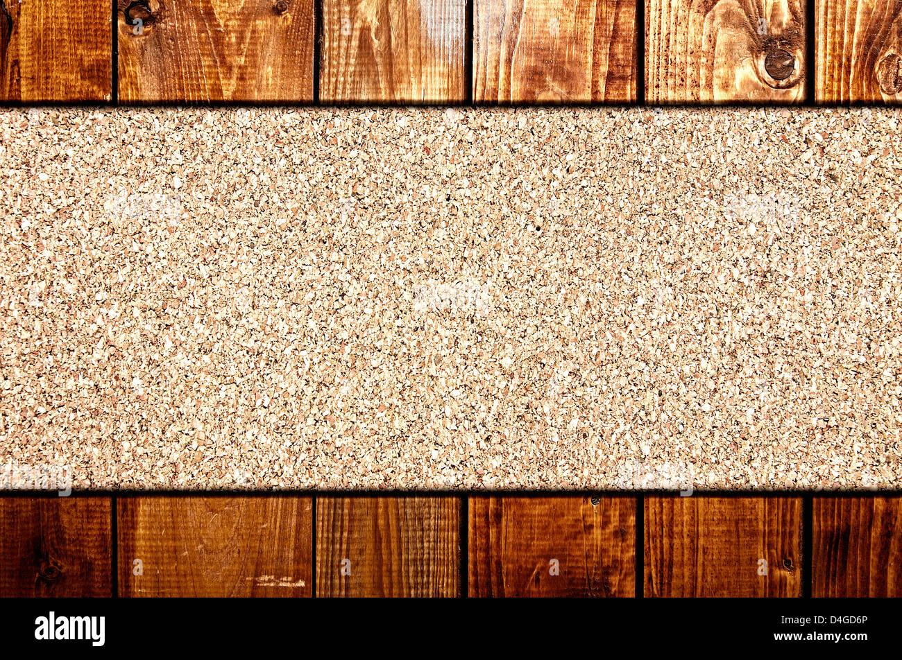 Cork board at wooden panel wall interior background Stock Photo