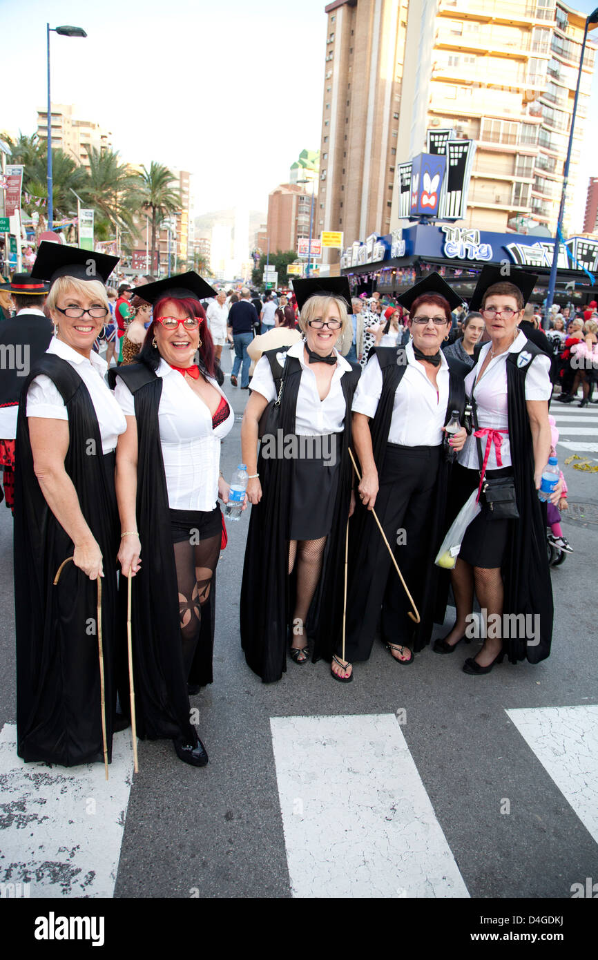 British fancy dress street party in Benidorm new town after the Spanish Fiesta people dressed in costumes Stock Photo
