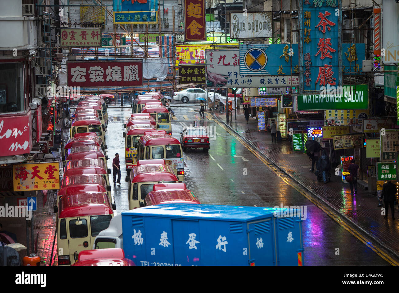 A busy street scene in Kowloon, Hong Kong, China on a rainy afternoon