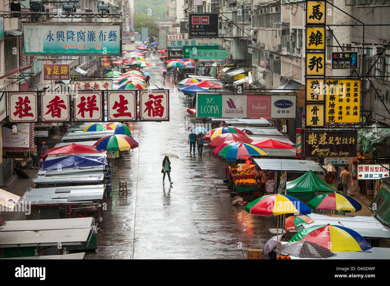 A busy street scene in Kowloon, Hong Kong, China on a rainy afternoon