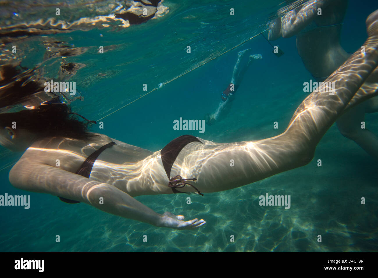 Elaphiten, Croatia, girls diving in the Adriatic Stock Photo