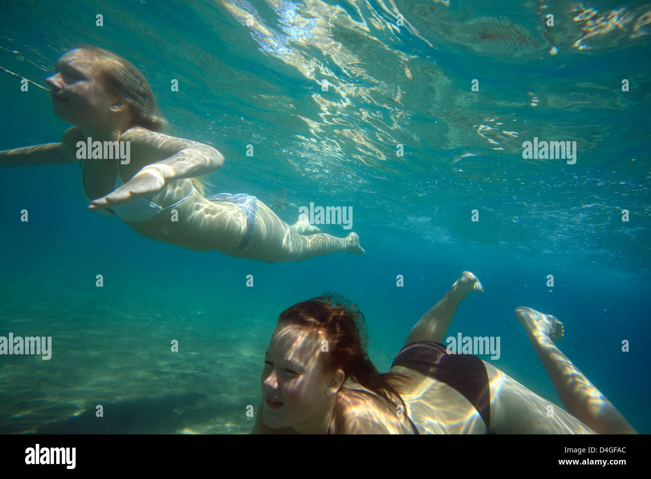 Elaphiten, Croatia, girls diving in the Adriatic Stock Photo