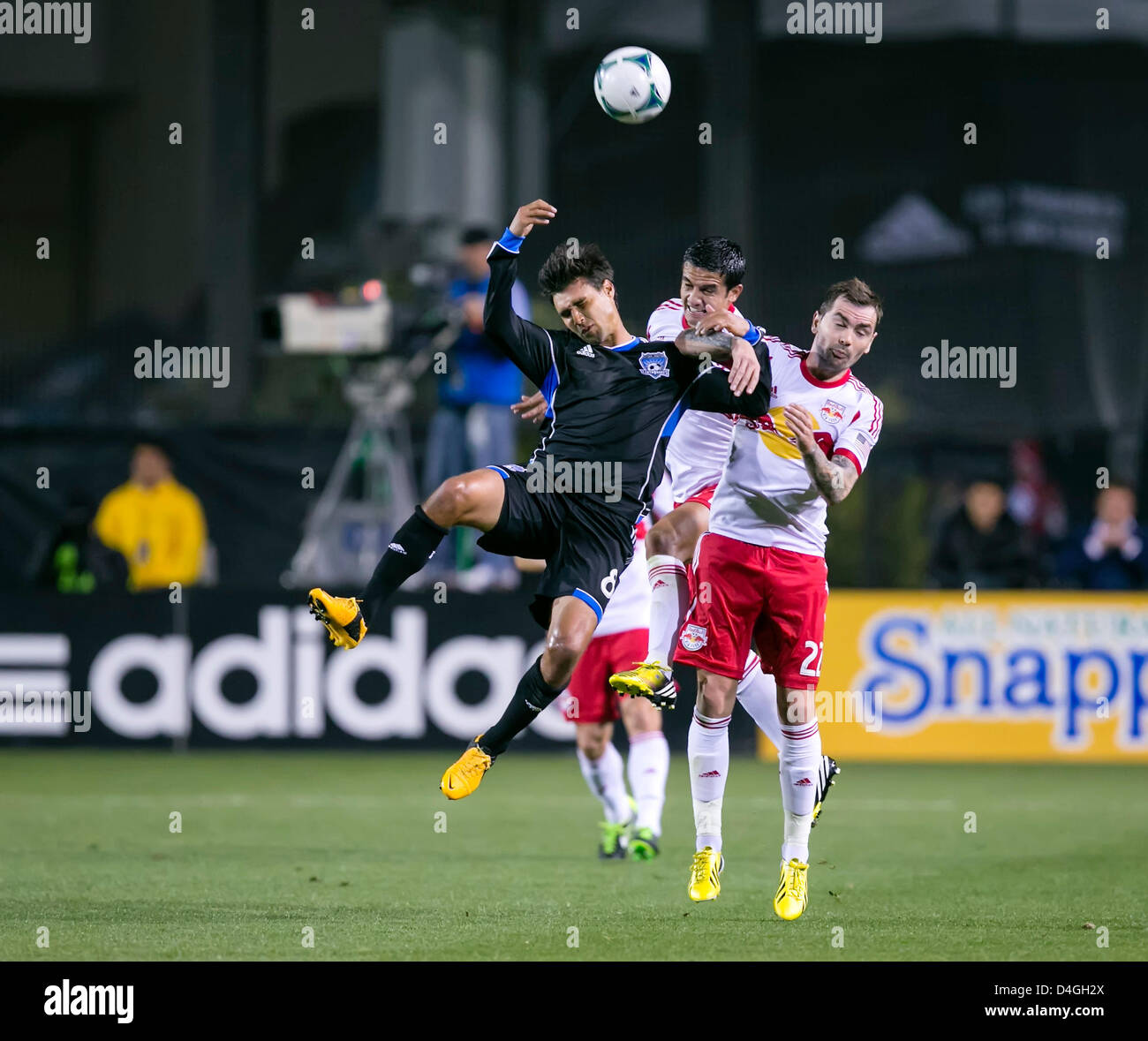 March 10, 2013: San Jose Earthquakes forward Chris Wondolowski (8) is elbowed in the face during the MLS game between the New York Red Bulls and the San Jose Earthquakes at Buck Shaw Stadium in Santa Clara CA. San Jose defeated New York 2-1. Stock Photo