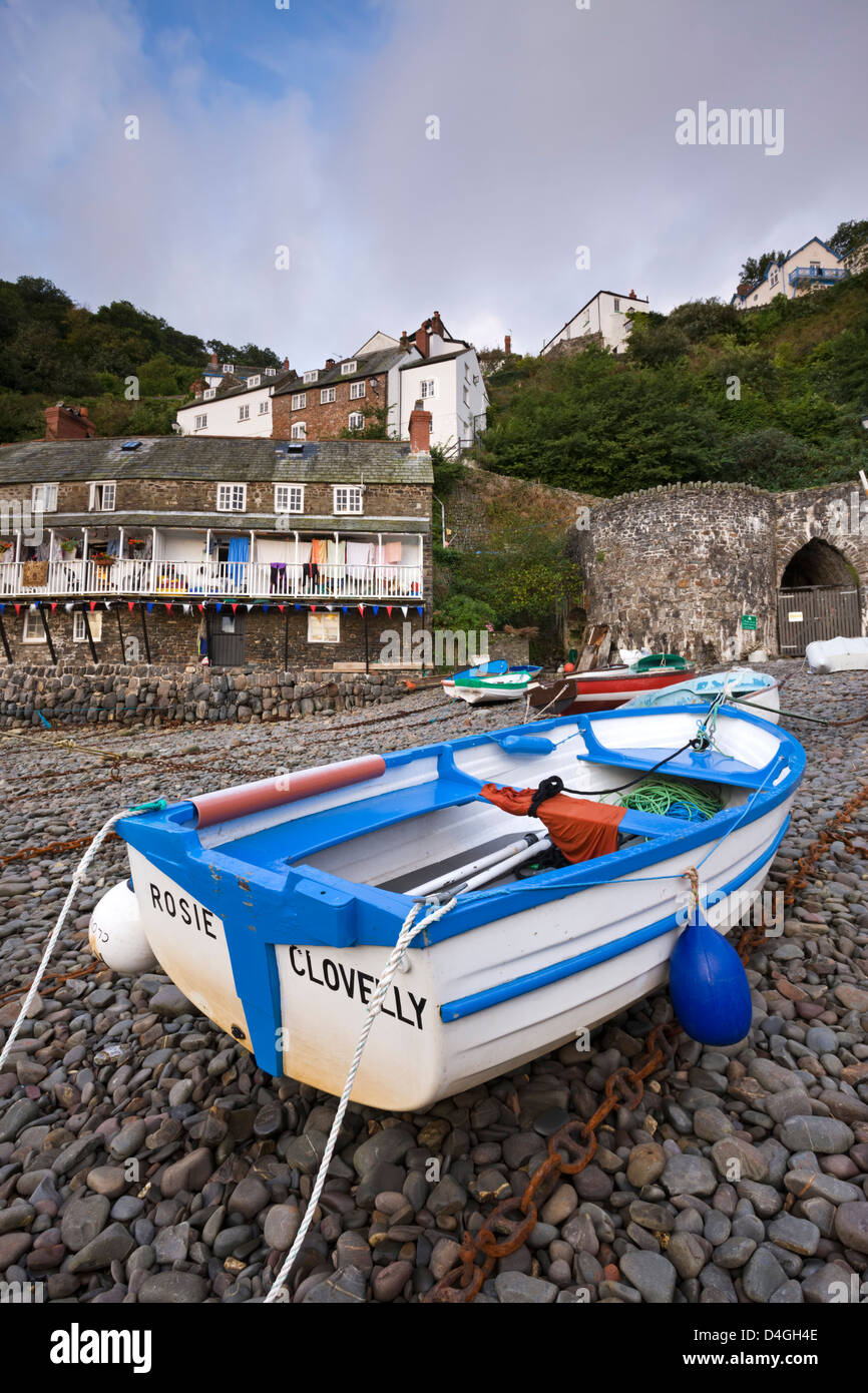 Fishing boat on the pebble beach in Clovelly harbour, Devon, England. Autumn (September). Stock Photo