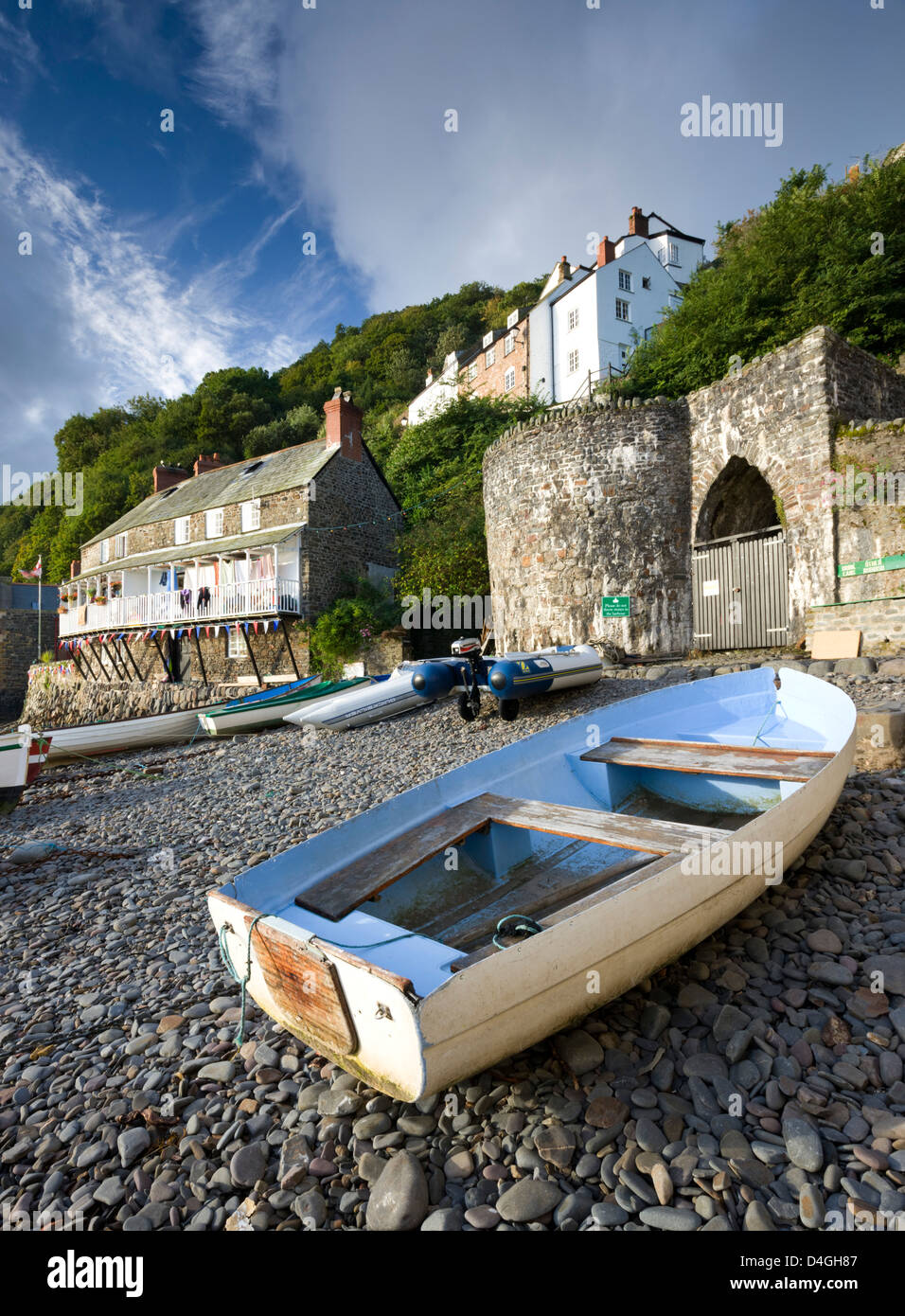Fishing boat on the pebble beach in Clovelly harbour, Devon, England. Autumn (September). Stock Photo
