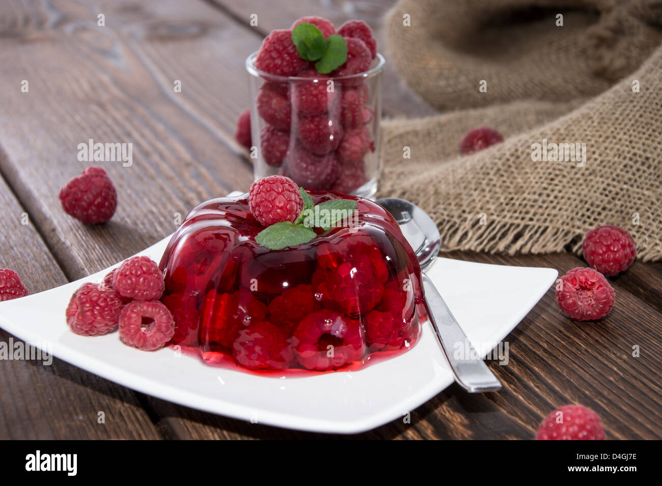 Raspberry Jello with fresh fruits Stock Photo - Alamy