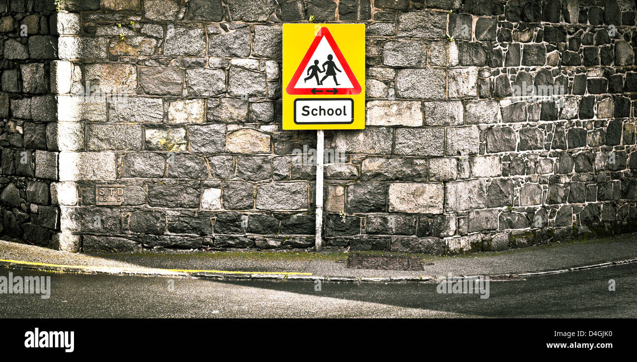 Warning sign for a school on a roadside Stock Photo