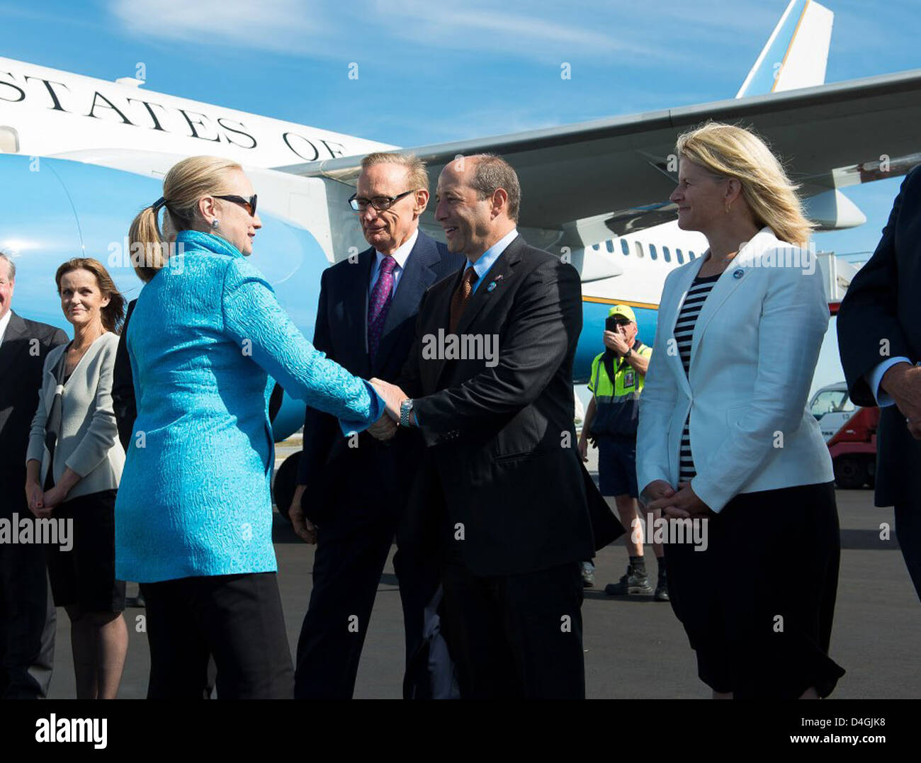 Secretary Clinton Is Greeted By Ambassador Bleich Stock Photo