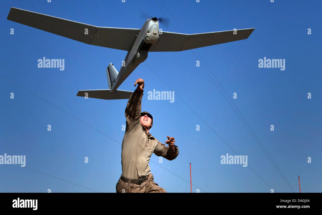 A US Marine launches the Puma aerial drone during an operation at Patrol  Base Boldak March 4, 2013 in Afghanistan. To operate, the Puma must be  launched by hand Stock Photo - Alamy