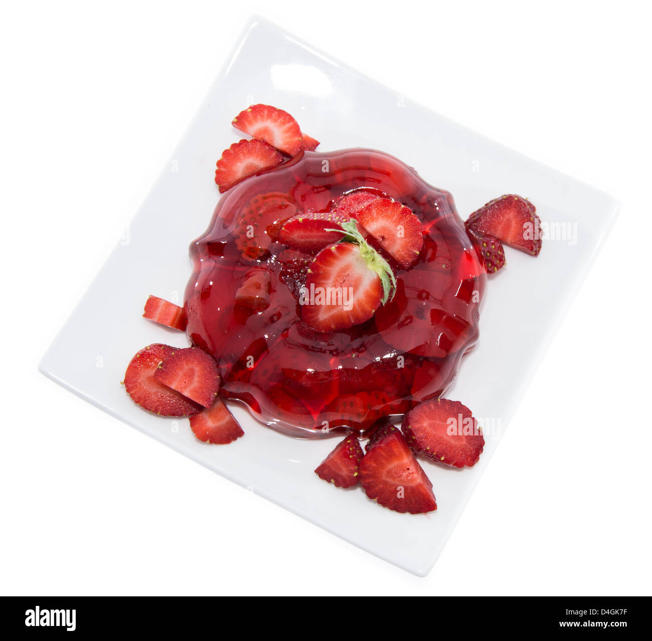 Strawberry Jello with fresh fruits isolated on white backround Stock