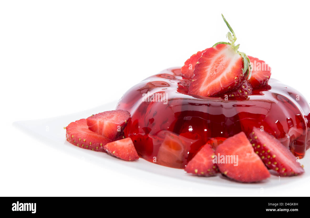 Strawberry Jello with fresh fruits isolated on white backround Stock