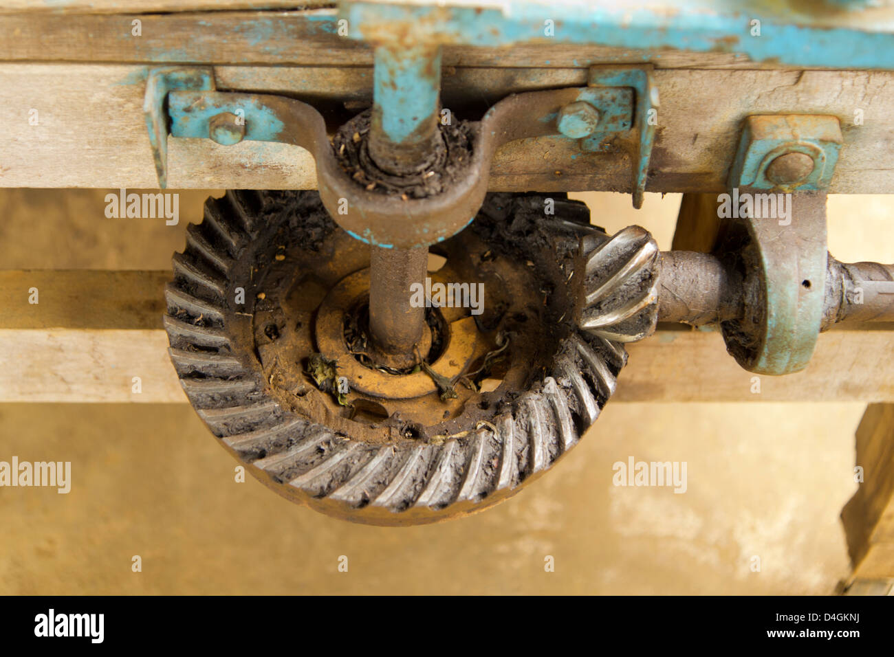 A large gear and a small gear mesh together Stock Photo Alamy