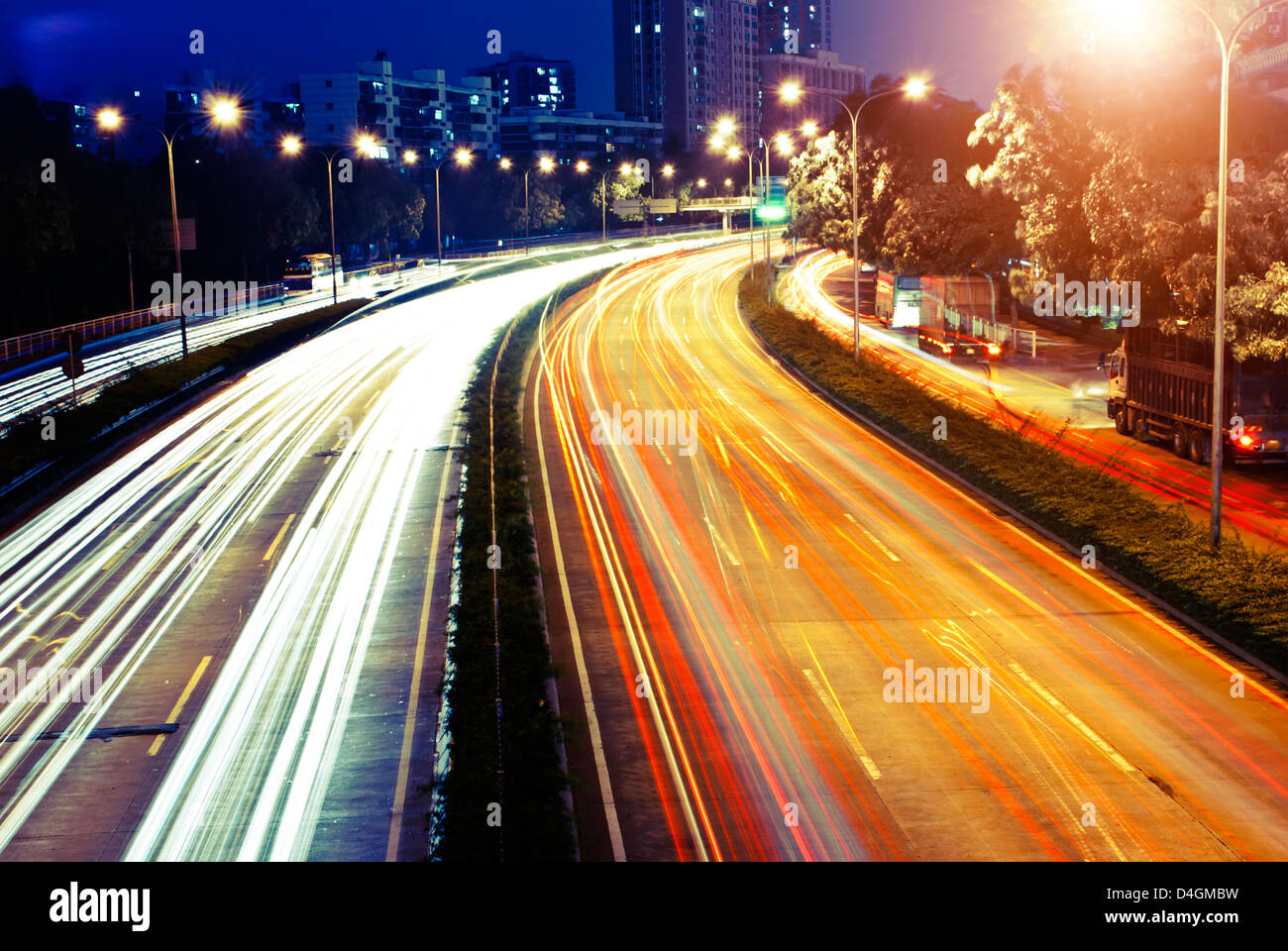moving car with blur light through city at night Stock Photo