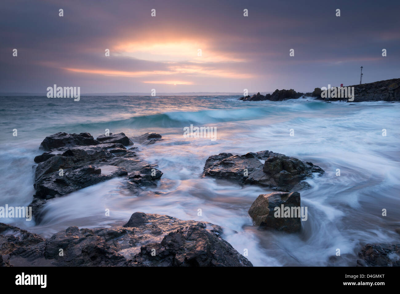 Sunrise at Porthgwidden Beach in St Ives, Cornwall, England. Winter (March) 2013. Stock Photo