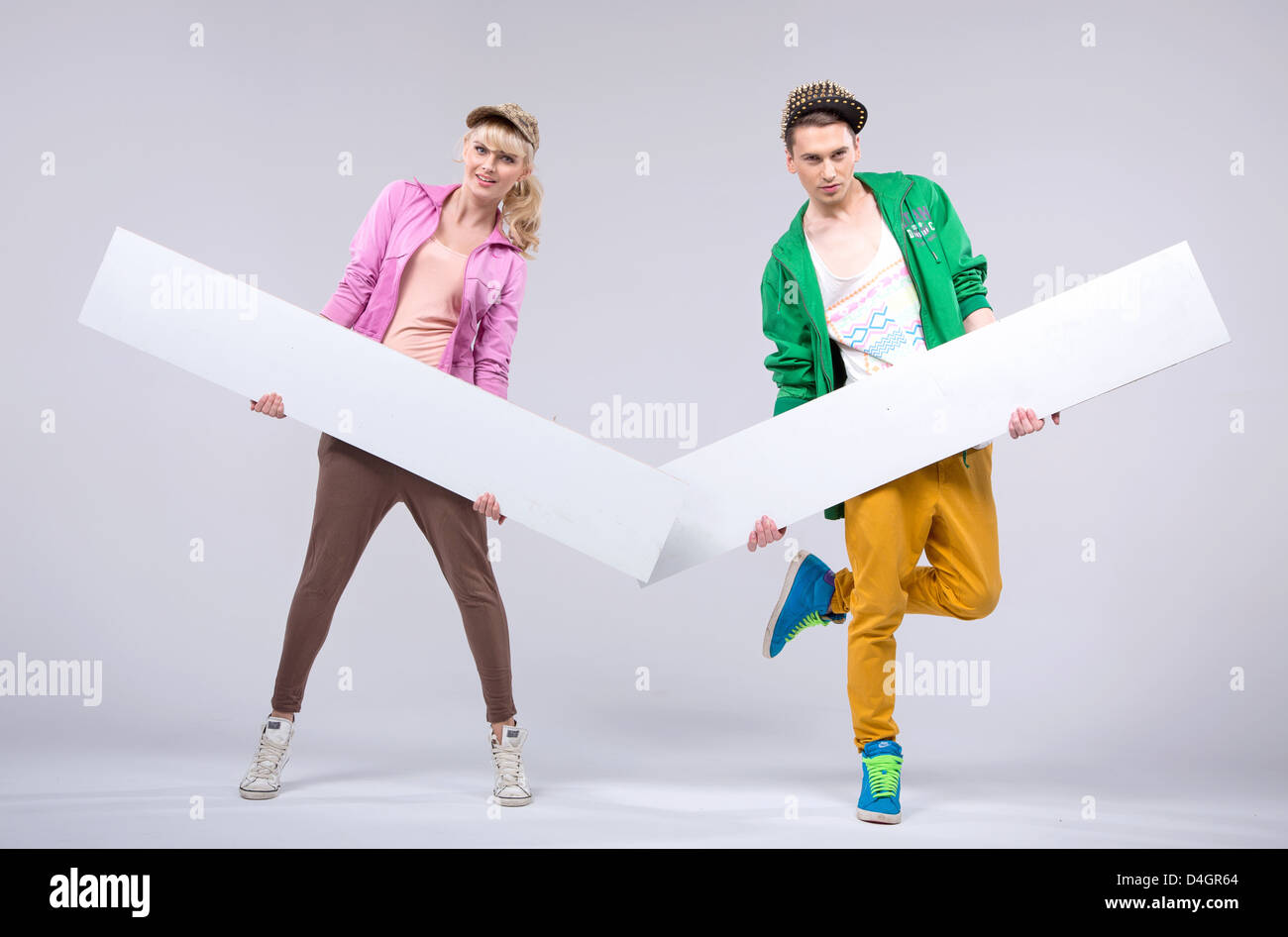 Two hip-hop young dancers showing empty boards Stock Photo