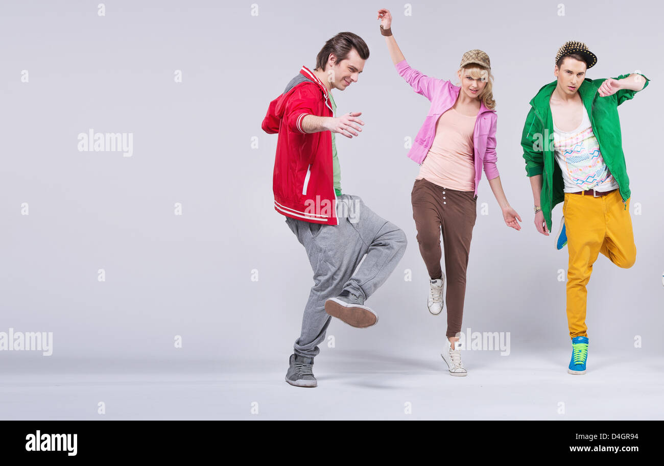 Group of cheerful young friends dancing together Stock Photo