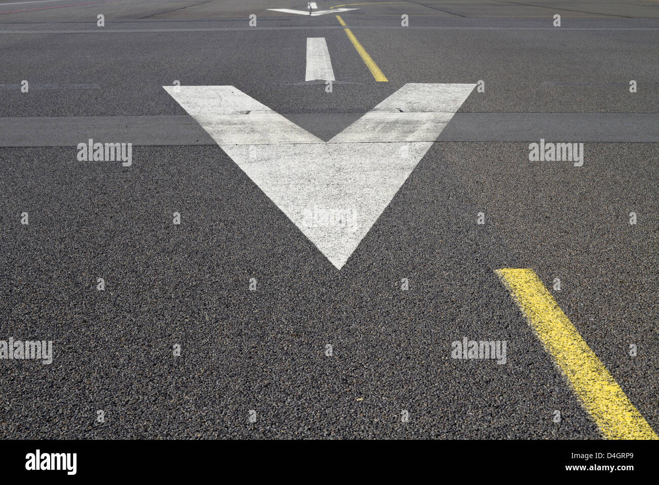 Arrows on the surface of a runway Stock Photo