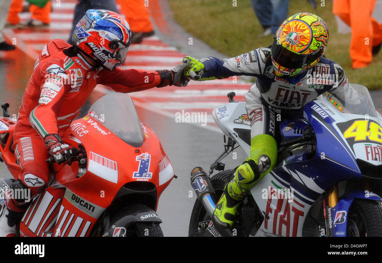 Italian runner-up Valentino Rossi (R) congratulates Australian motorbike  driver Casey Stoner (L) after Stoner's victory of the MotoGP class at the  German Grand Prix at 'Sachsenring' race track near Hohenstein-Ernstthal,  Germany, 13