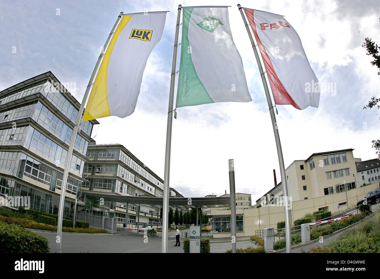 Flags wave in the wind outside the headquarters of German mechanical engineering company 'Schaeffler KG' in Herzogenaurach, Germany, 14 July 2008. According to press reports Schaeffler group considers selling parts of the company after a possible take over of 'Continental'. In order to cut debts 'Schaeffler KG' may then sell the tyres branch and 'ContiTech'. Photo: DANIEL KARMANN Stock Photo