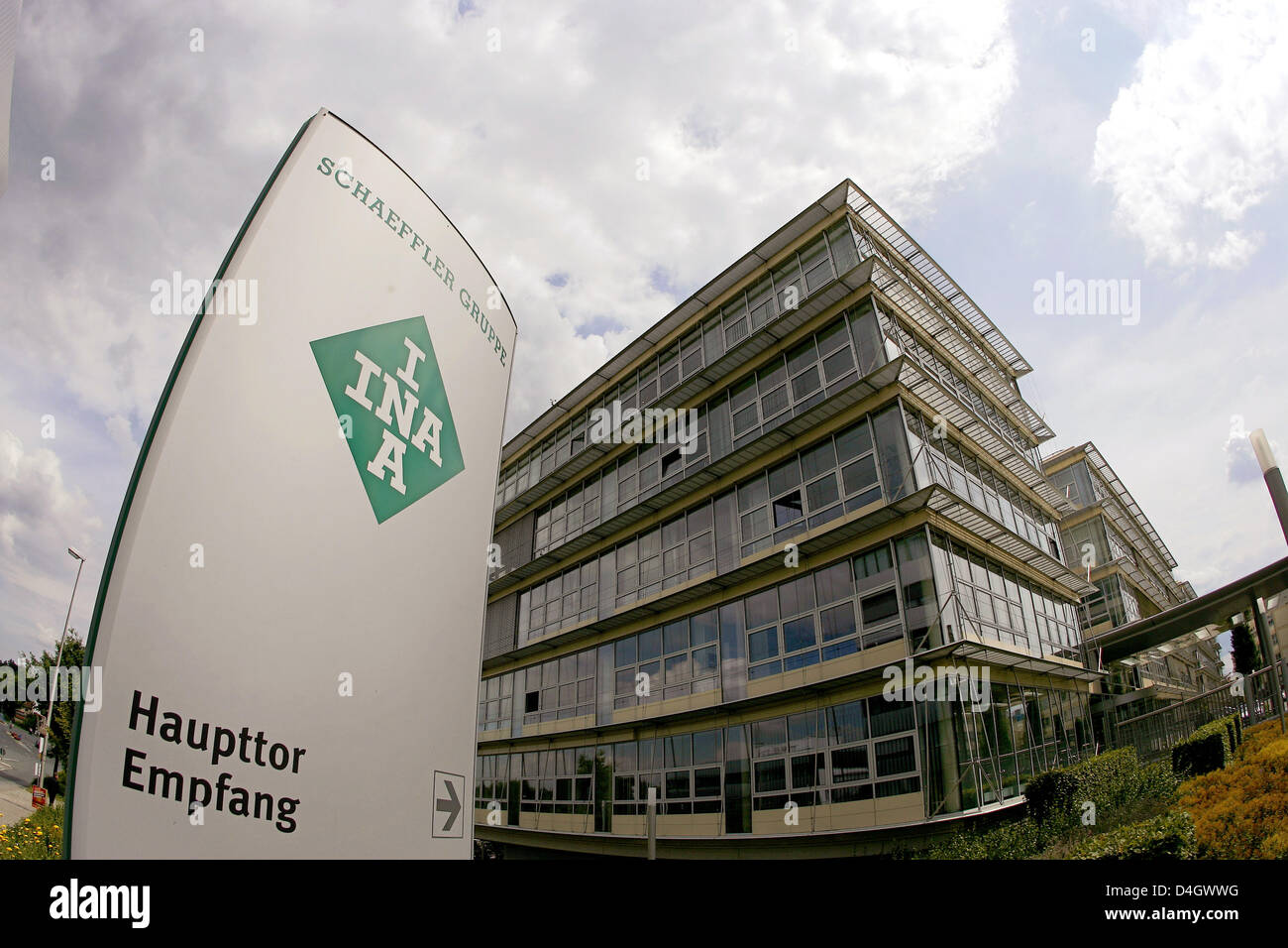 Flags wave in the wind outside the headquarters of German mechanical engineering company 'Schaeffler KG' in Herzogenaurach, Germany, 14 July 2008. According to press reports Schaeffler group considers selling parts of the company after a possible take over of 'Continental'. In order to cut debts 'Schaeffler KG' may then sell the tyres branch and 'ContiTech'. Photo: DANIEL KARMANN Stock Photo