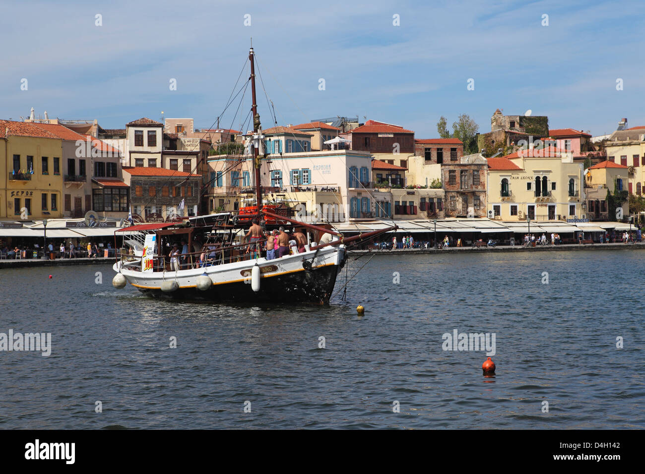 A traditional Cretan boat in the Venetian era harbour at the Mediterranean port of Chania (Canea), Crete, Greek Islands, Greece Stock Photo