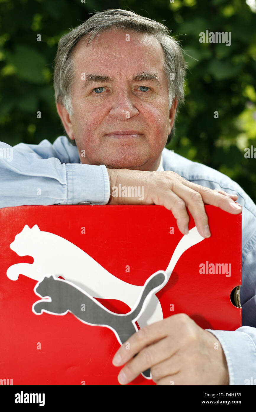 Drawer and caricaturist Lutz Backes poses with the 'Puma' company logo in  Nuremberg, Germany, 16 July 2008. Mr Backes aka 'Bubec', inventer and  creator of the 'Puma' company logo, celebrated his 70th