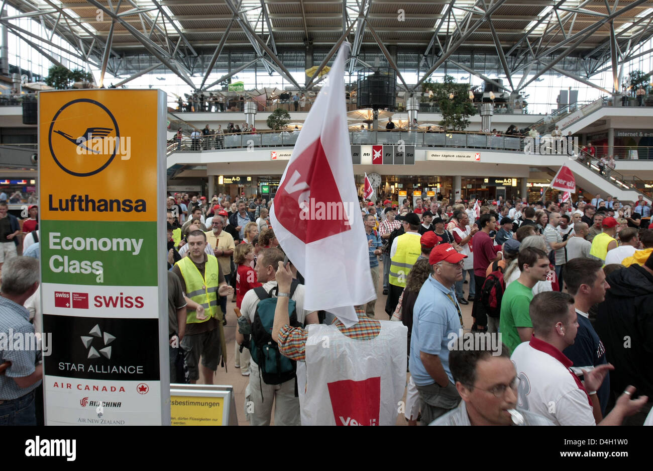 A total of 1,200 employees of Lufthansa Technik are on strike in Hamburg, Germany, 30 July 2008. The labour dispute is set to continue open-ended as service union 'ver.di' demands a pay-rise of 9.8 per cent over one year for their 50,000 members employed at Lufthansa. The German carrier offers 7.7 per cent over 21 months to date and proposed to solve the action in an arbitration. P Stock Photo