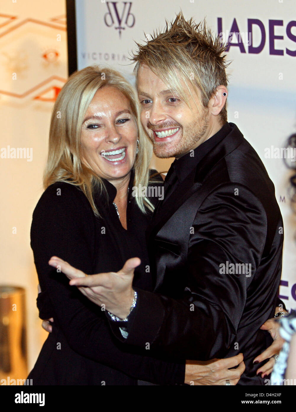 Store manager Evelyn Hammerstroem (L) and entertainer Ross Anthony pose during the presentation of Ex-Spice Girl Victoria Beckham's jeans collection 'dVb' at a fashion store in Duesseldorf, Germany, 15 October 2008. Beckham introduced special guests and celebrities to the highlights of her collection. Photo: Franz-Peter Tschauner Stock Photo