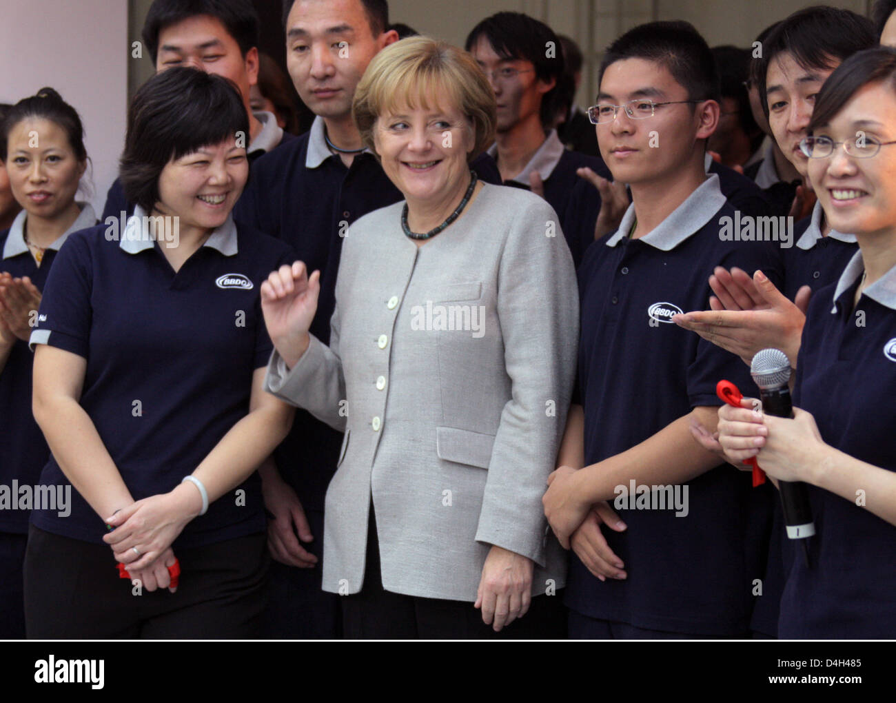German Chancellor Angela Merkel visits the Mercedes-Benz factory when vehicle no. 25,000 is being produced in Beijing, China, 23 October 2008. Merkel will hold bilateral talks and attend the Asia-Europe Meeting (ASEM) during her three-day stay at the chinese capital. Photo: Peer Grimm Stock Photo