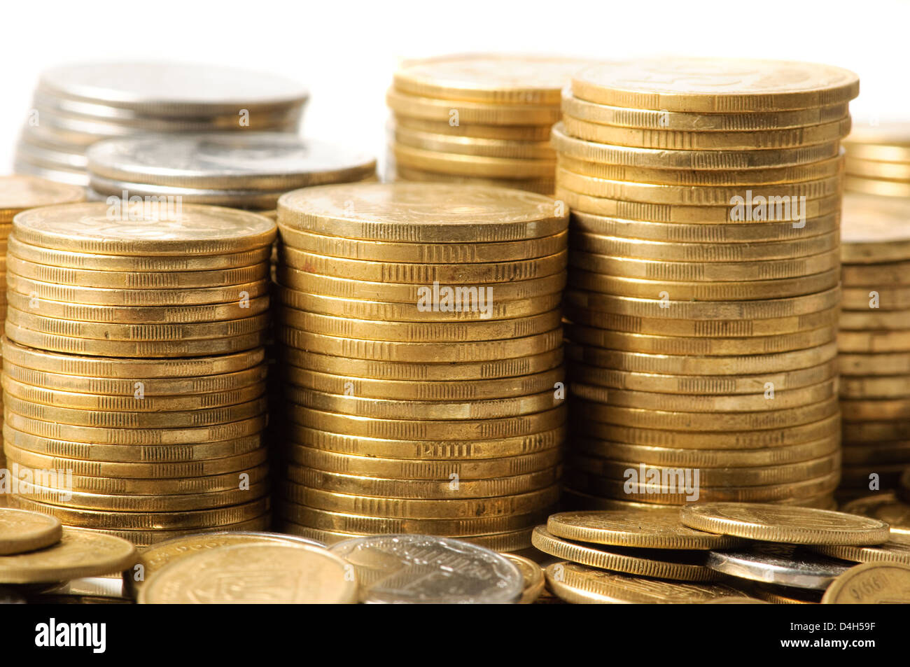 Stacks of coins. Isolated on white background Stock Photo - Alamy