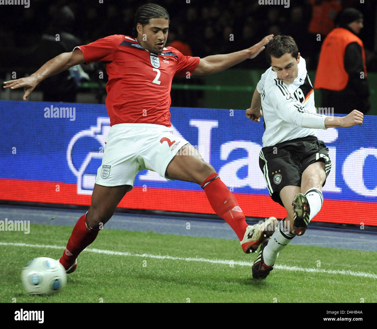 Germany?s Marcel Schaefer (R) brings the cross past England?s Glen Johnson (L) during their friendly match at Olympi stadium in Berlin, Germany, 19 November 2008. England defeated Germany 2-1. Photo: Jochen Luebke Stock Photo