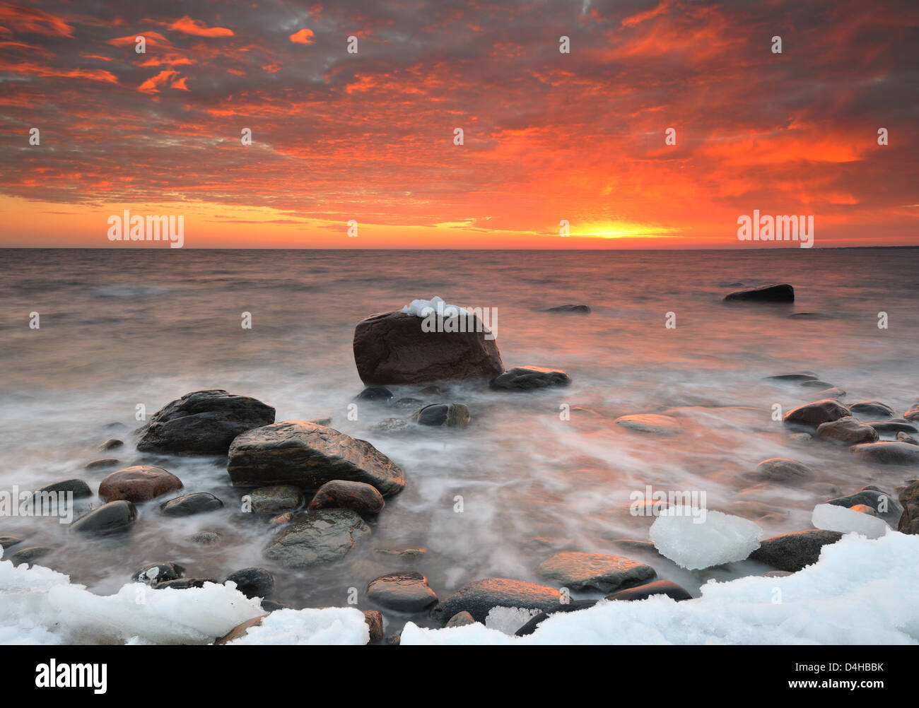 Seascape with rocks and ice at sunset, Näsbokrok Naturreservat, Halland, Sweden, Europe Stock Photo