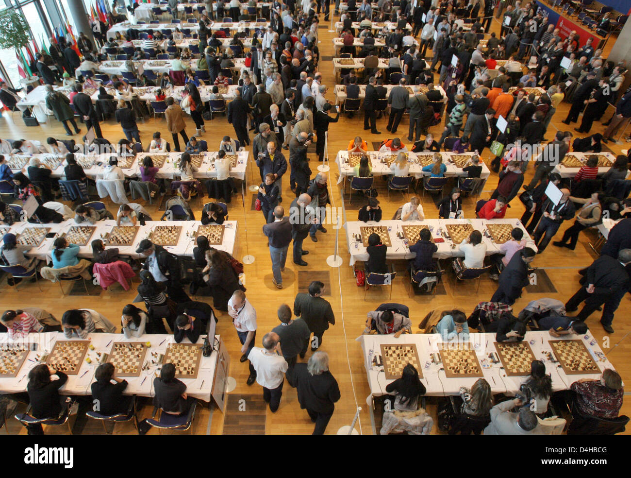 Eight-year-old Tim Wagner stands in front of ?his? poster and smiles during  the 2008 Chess Olympiad in Dresden, Germany, 15 November 2008. His is one  of the face represented during the advertisement