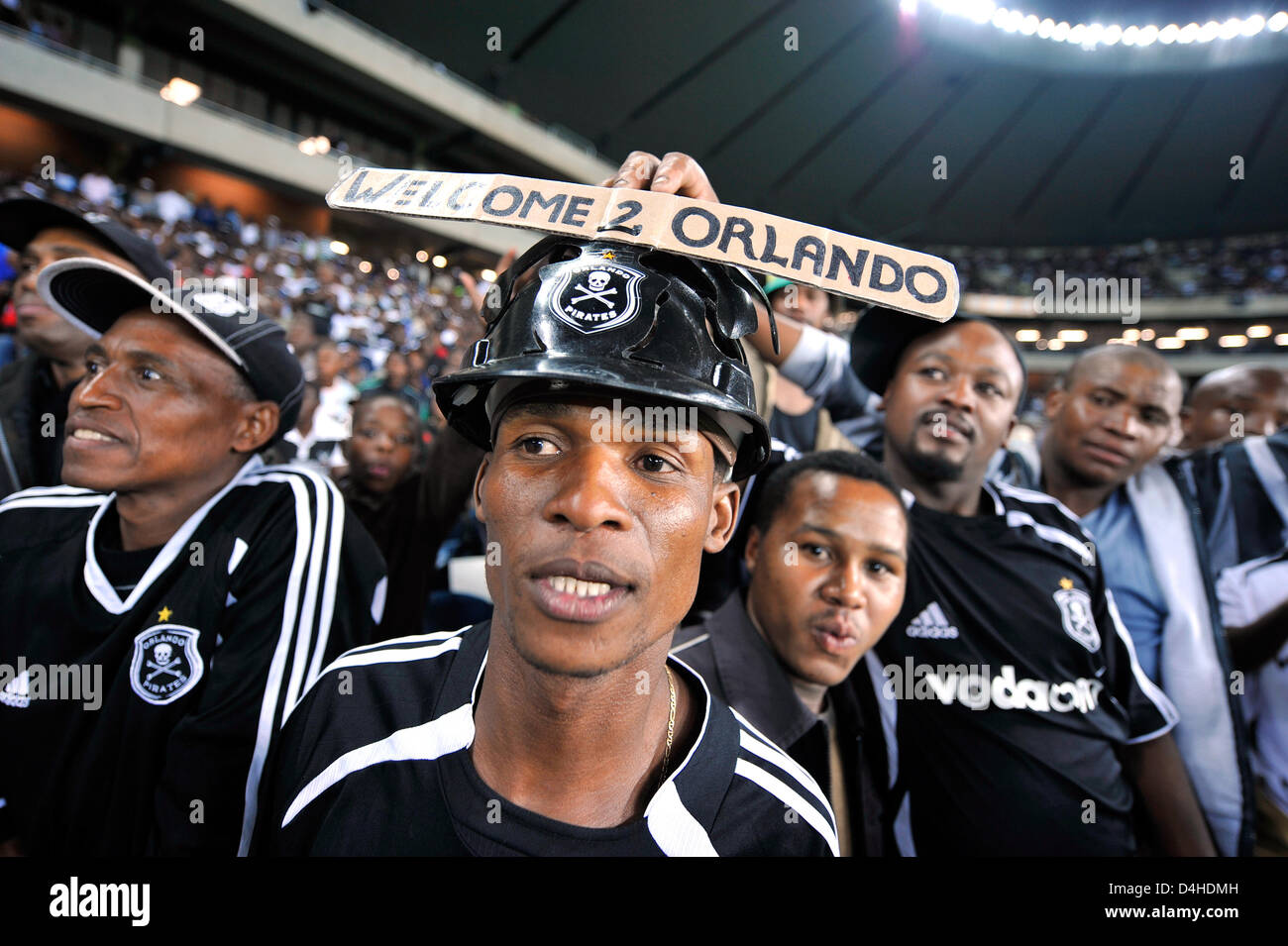 Supporters of Orlando Pirates cheers their team during the soccer match Orlando Pirates v Thanda Royal